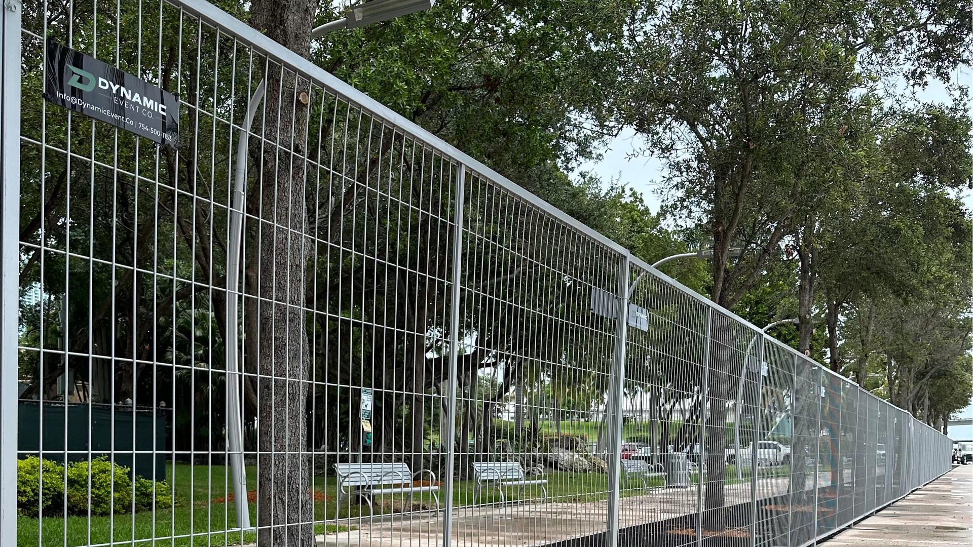 Dynamic's metal barrier fence running along a sidewalk